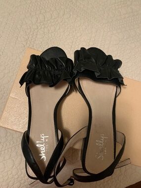 Black low heeled open toe shoes
